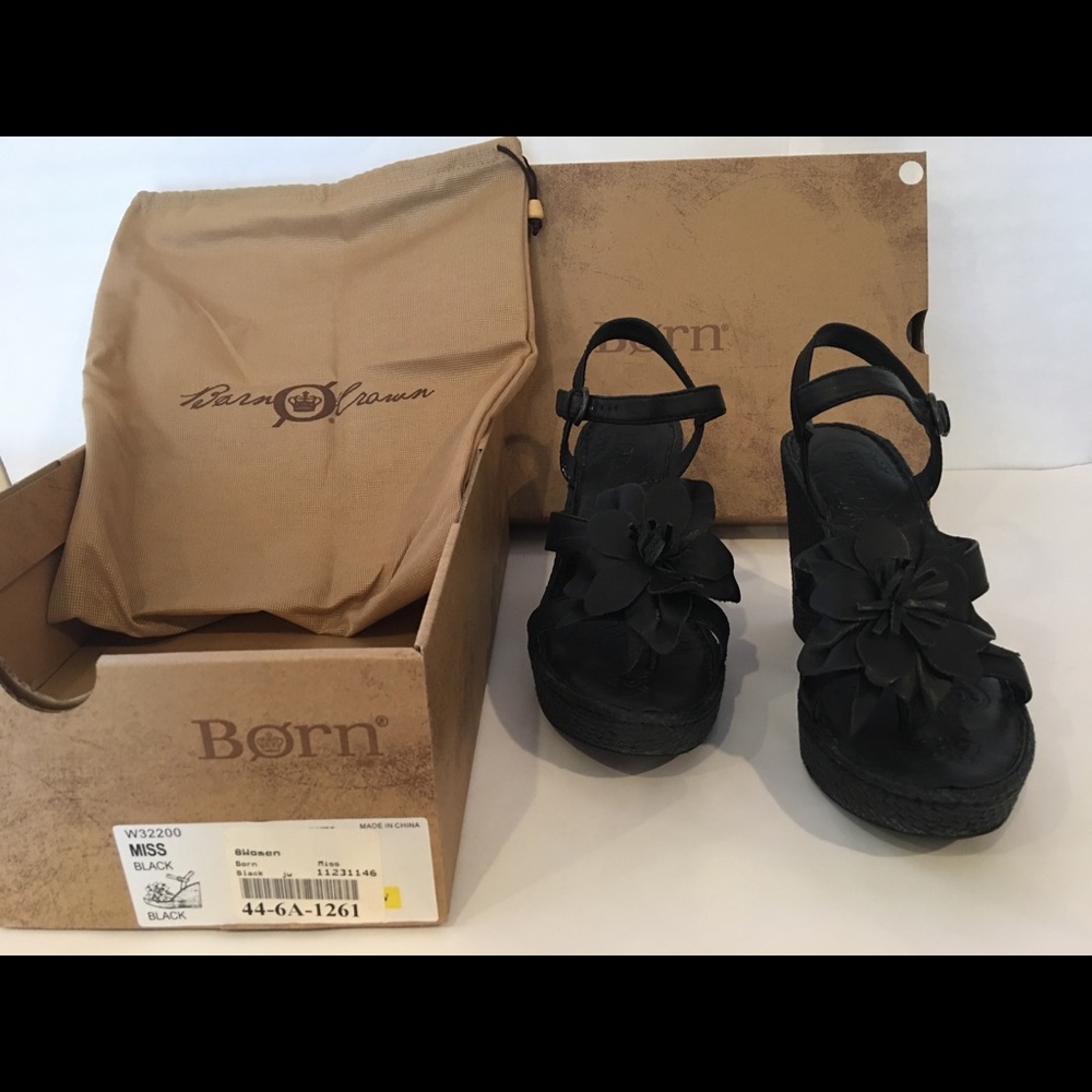 Born size 8, black wedges.